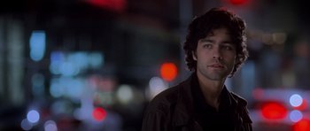 Movie still from “The Devil Wears Prada” (2006), directed by David Frankel – A person wearing a black jacket; Close Up shot, Over the shoulder angle