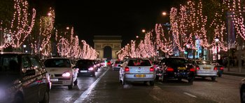 Movie still from “The Devil Wears Prada” (2006), directed by David Frankel – A street filled with lots of traffic at night time; Extreme Wide shot, High angle