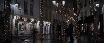 Movie still from “The Devil Wears Prada” (2006), directed by David Frankel – A couple of people walking down a street at night; Extreme Wide shot, Over the shoulder angle