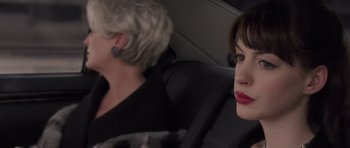 Movie still from “The Devil Wears Prada” (2006), directed by David Frankel – Two women sitting in the back seat of a car; Close Up shot, Over the shoulder angle