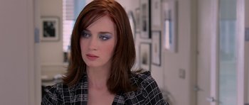 Movie still from “The Devil Wears Prada” (2006), directed by David Frankel – A person wearing a plaid shirt; Close Up shot, Over the shoulder angle