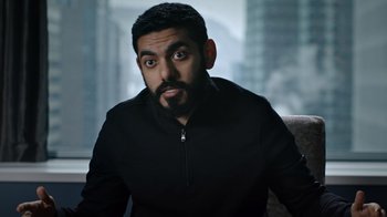 Movie still from “The Dissident” (2020), directed by Bryan Fogel – A man with a goatee and a black shirt; Close Up shot, High angle