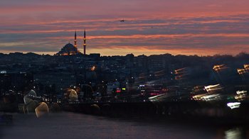 Movie still from “The Dissident” (2020), directed by Bryan Fogel – A view of a city at night from the water; Extreme Wide shot, High angle