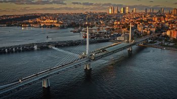 Movie still from “The Dissident” (2020), directed by Bryan Fogel – An aerial view of a bridge over a body of water; Extreme Wide shot, High angle