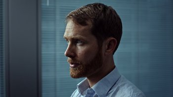 Movie still from “The Dissident” (2020), directed by Bryan Fogel – A person with a beard; Close Up shot, Over the shoulder angle