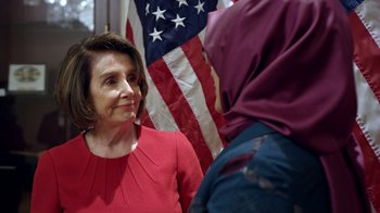 Movie still from “The Dissident” (2020), directed by Bryan Fogel – A person talking to another person in front of an american flag; Close Up shot, Low angle