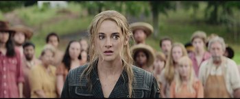 Movie still from “The Divergent Series: Insurgent” (2015), directed by Robert Schwentke – A person with a crowd of people; Close Up shot, Over the shoulder angle