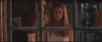 Movie still from “The Divergent Series: Insurgent” (2015), directed by Robert Schwentke – A woman standing in front of a window; Close Up shot, Over the shoulder angle