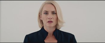 Movie still from “The Divergent Series: Insurgent” (2015), directed by Robert Schwentke – A woman with blonde hair wearing a black shirt; Close Up shot, Low angle