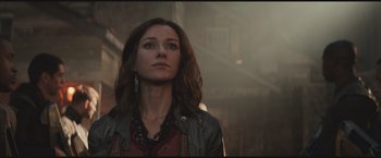 Movie still from “The Divergent Series: Insurgent” (2015), directed by Robert Schwentke – A woman with long brown hair wearing a leather jacket; Close Up shot, Low angle