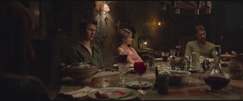 Movie still from “The Divergent Series: Insurgent” (2015), directed by Robert Schwentke – A man and a woman sitting at a dinner table; Medium shot, High angle