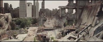 Movie still from “The Divergent Series: Insurgent” (2015), directed by Robert Schwentke – An old truck is parked in the middle of a destroyed city; Extreme Wide shot, High angle