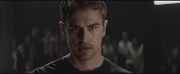 Movie still from “The Divergent Series: Insurgent” (2015), directed by Robert Schwentke – A person wearing a black t - shirt; Close Up shot, Low angle