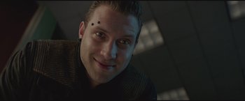 Movie still from “The Divergent Series: Insurgent” (2015), directed by Robert Schwentke – A person smiling for the camera; Close Up shot, Low angle