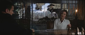 Movie still from “The Divergent Series: Insurgent” (2015), directed by Robert Schwentke – A view of a city from a window of a building; Medium shot, Over the shoulder angle