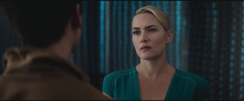 Movie still from “The Divergent Series: Insurgent” (2015), directed by Robert Schwentke – A woman in a green shirt is looking at a man in a blue shirt; Close Up shot, Over the shoulder angle