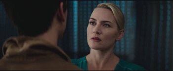 Movie still from “The Divergent Series: Insurgent” (2015), directed by Robert Schwentke – A person looking at a person in a mirror; Close Up shot, Over the shoulder angle