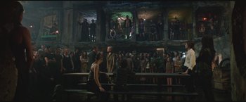 Movie still from “The Divergent Series: Insurgent” (2015), directed by Robert Schwentke – A group of people standing in front of an audience; Wide shot, High angle