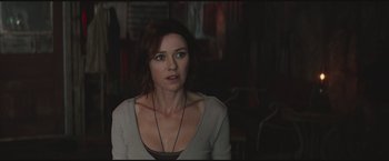 Movie still from “The Divergent Series: Insurgent” (2015), directed by Robert Schwentke – A person wearing a necklace; Close Up shot, Over the shoulder angle