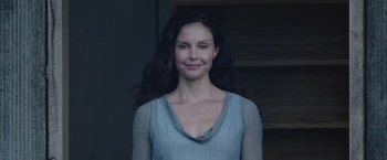 Movie still from “The Divergent Series: Insurgent” (2015), directed by Robert Schwentke – A woman with long black hair wearing a blue shirt; Close Up shot, Low angle