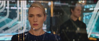 Movie still from “The Divergent Series: Insurgent” (2015), directed by Robert Schwentke – A woman with blonde hair and a blue dress; Close Up shot, Low angle