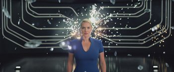 Movie still from “The Divergent Series: Insurgent” (2015), directed by Robert Schwentke – A woman standing in front of a fireworks display; Medium shot, Low angle