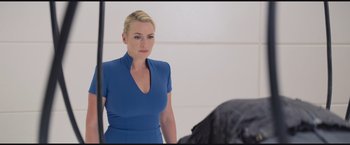 Movie still from “The Divergent Series: Insurgent” (2015), directed by Robert Schwentke – A woman standing in front of a bathroom mirror; Medium shot, Over the shoulder angle