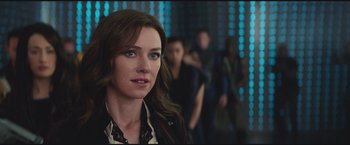 Movie still from “The Divergent Series: Insurgent” (2015), directed by Robert Schwentke – A person wearing a leather jacket; Close Up shot, Over the shoulder angle