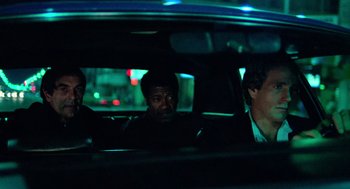 Movie still from “The Driver” (1978), directed by Walter Hill – Three people in a car at night in the dark; Medium shot, Over the shoulder angle