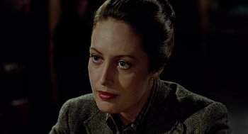 Movie still from “The Driver” (1978), directed by Walter Hill – A person wearing a jacket; Close Up shot, Over the shoulder angle