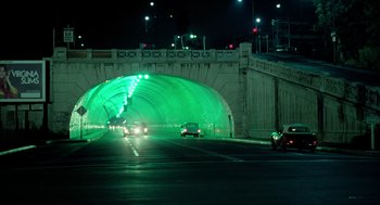 Movie still from “The Driver” (1978), directed by Walter Hill – Cars driving down a street at night under an overpass; Extreme Wide shot, High angle