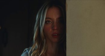 Movie still from “Euphoria” (2019), created by Sam Levinson – A woman with long blonde hair looking at the camera; Close Up shot, Low angle