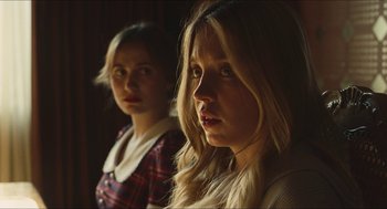 Movie still from “Euphoria” (2019), created by Sam Levinson – Two young women standing next to each other in a room; Close Up shot, Over the shoulder angle