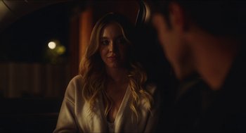 Movie still from “Euphoria” (2019), created by Sam Levinson – A woman in a white robe looking at a man in a black suit; Close Up shot, Over the shoulder angle