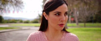 Movie still from “Culture Shock” (2019), directed by Andrew Essig – A person wearing a pink shirt; Close Up shot, Low angle