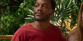 A person wearing a red t - shirt