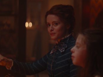 Movie still from “The Electrical Life of Louis Wain” (2021), directed by Will Sharpe – A woman and a girl are standing next to each other in a room; Close Up shot, Over the shoulder angle