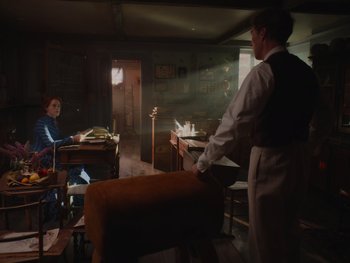 Movie still from “The Electrical Life of Louis Wain” (2021), directed by Will Sharpe – A man and a woman are in a room; Wide shot, Over the shoulder angle