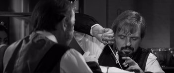 Movie still from “The Elephant Man” (1980), directed by David Lynch – Two men in black and white shirts and ties; Close Up shot, Over the shoulder angle