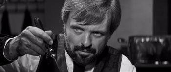 Movie still from “The Elephant Man” (1980), directed by David Lynch – Black and white photograph of a man with a beard; Close Up shot, Low angle