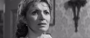 Movie still from “The Elephant Man” (1980), directed by David Lynch – Black and white photograph of a woman looking into the distance; Close Up shot, Over the shoulder angle