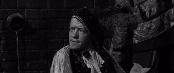 Movie still from “The Elephant Man” (1980), directed by David Lynch – An old man wearing a headdress and a scarf; Close Up shot, High angle