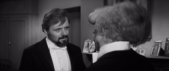 Movie still from “The Elephant Man” (1980), directed by David Lynch – Two men in tuxedos are looking at each other; Close Up shot, Over the shoulder angle