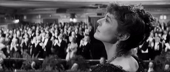 Movie still from “The Elephant Man” (1980), directed by David Lynch – A black - and - white photo of a woman in front of an audience; Close Up shot, Low angle