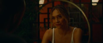 Movie still from “The Enforcer” (2022), directed by Richard Hughes – A beautiful young lady sitting in front of a mirror; Close Up shot, Over the shoulder angle