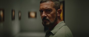 Movie still from “The Enforcer” (2022), directed by Richard Hughes – A person with a beard; Close Up shot, Low angle