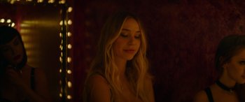 Movie still from “The Enforcer” (2022), directed by Richard Hughes – A beautiful blonde woman with long hair; Close Up shot, Low angle