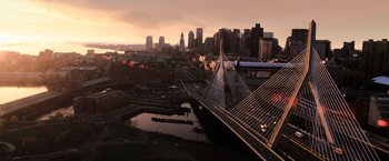Movie still from “The Equalizer” (2014), directed by Antoine Fuqua – An aerial view of a city skyline at sunset; Extreme Wide shot, High angle