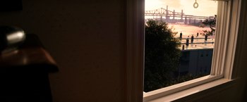 Movie still from “The Equalizer” (2014), directed by Antoine Fuqua – A view of a bridge from a window sill; Medium shot, Over the shoulder angle
