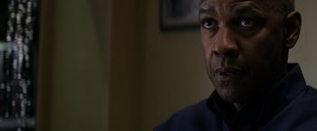 Movie still from “The Equalizer” (2014), directed by Antoine Fuqua – A man's face in front of a wall; Close Up shot, Low angle
